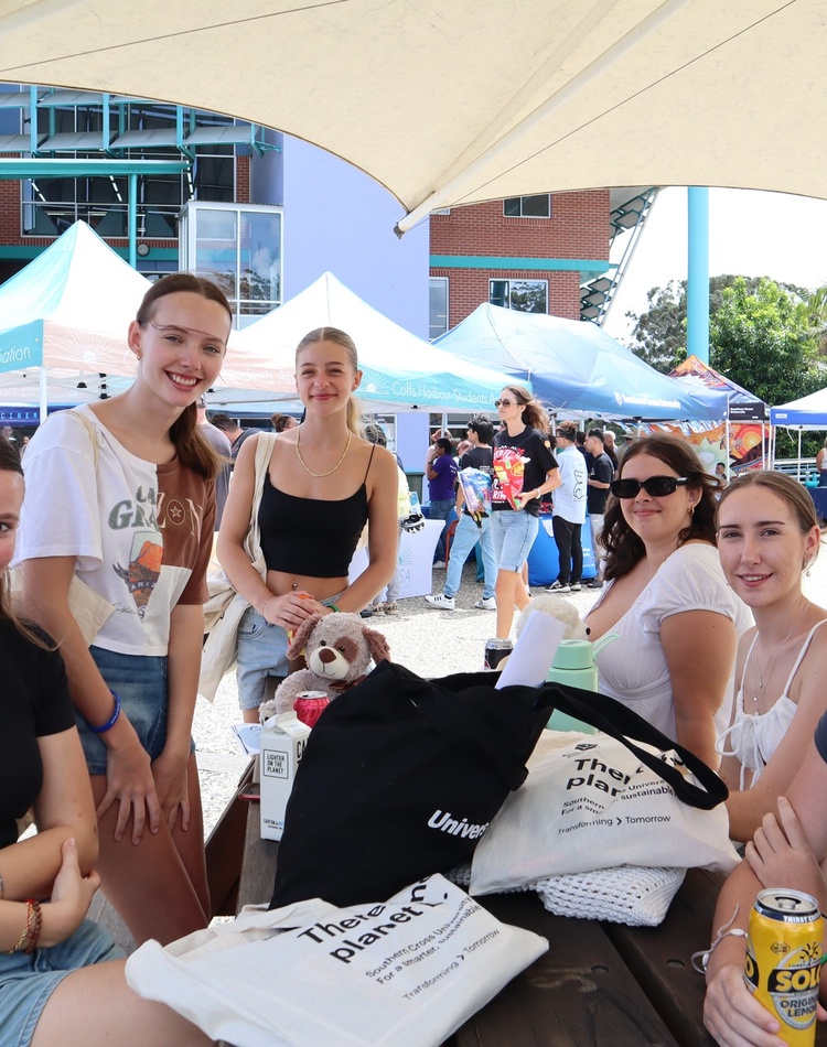 A group of smiling new students at a Coffs Harbour Orientation event