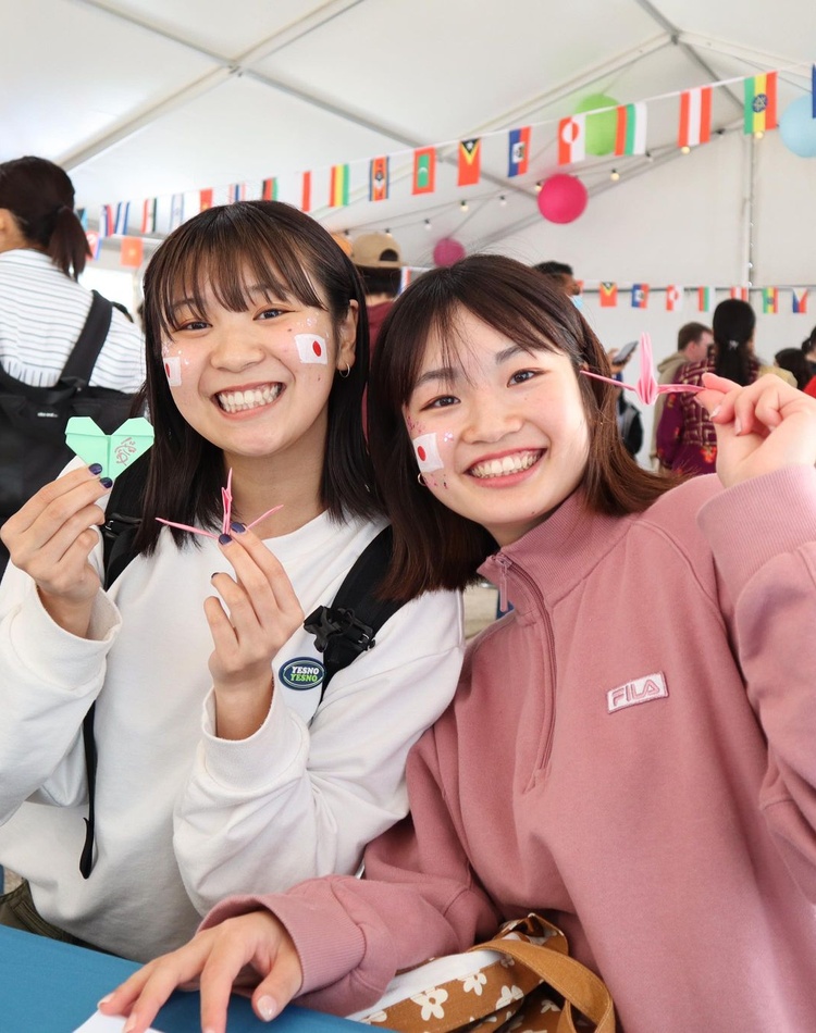 two students smiling for camera