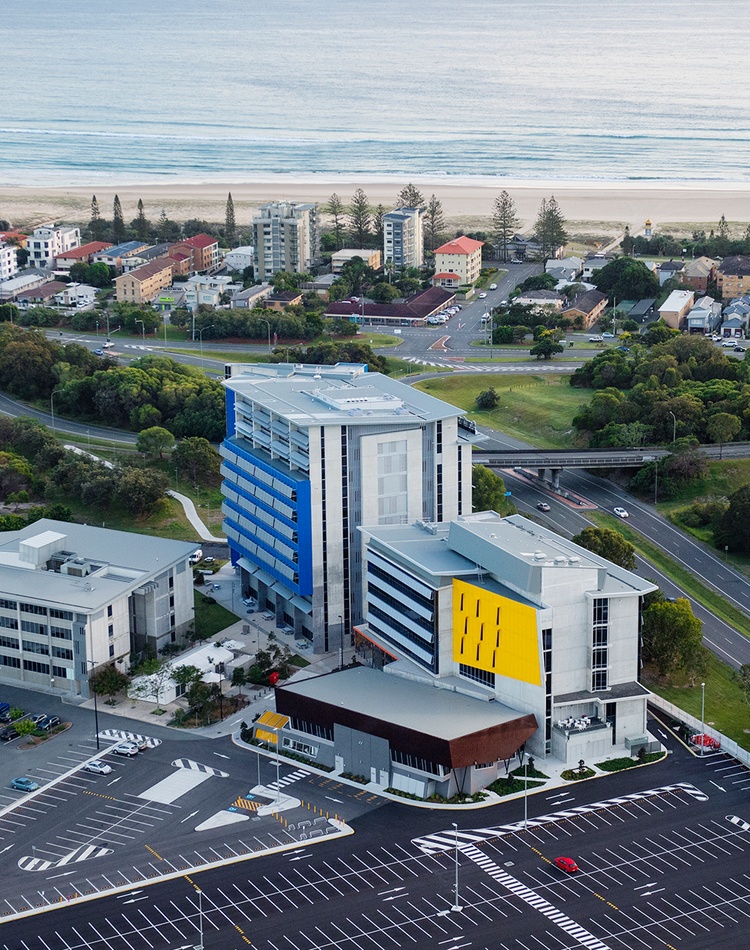 Aerial shot of Gold Coast campus with beach shoreline in the background