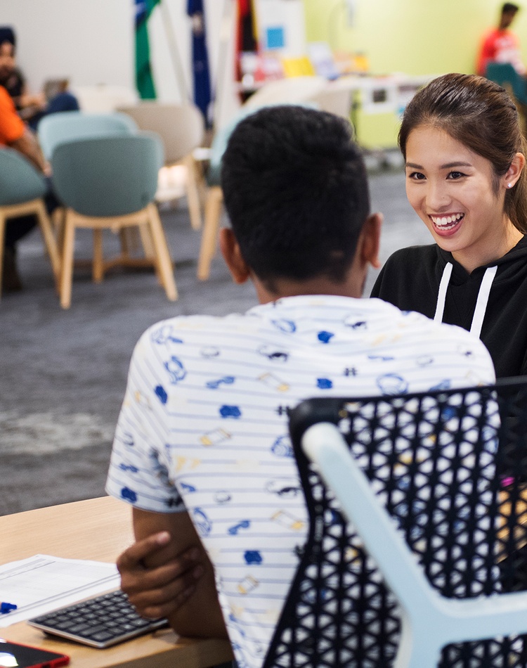 two international students sitting down