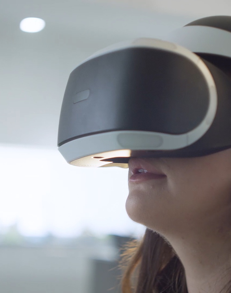 Female student wearing virtual reality VR goggles