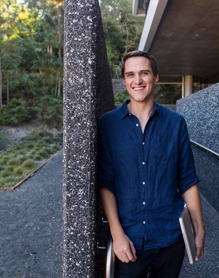Young man smiling and looking at camera