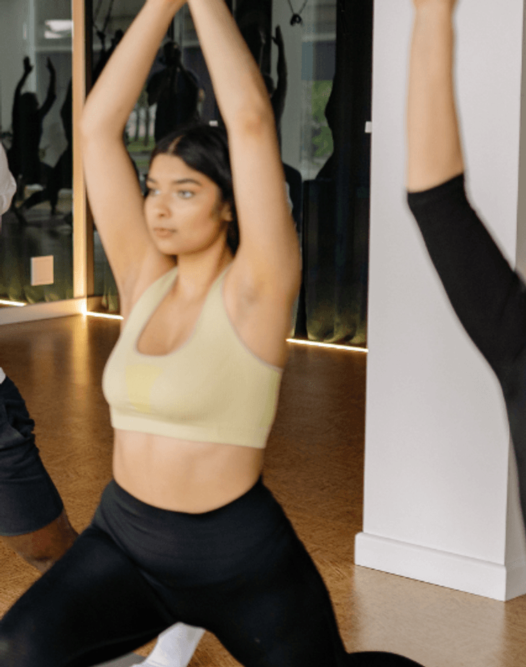 group of people practising yoga