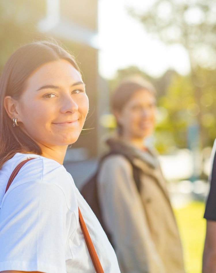 Student group smiling on Gold Coast campus