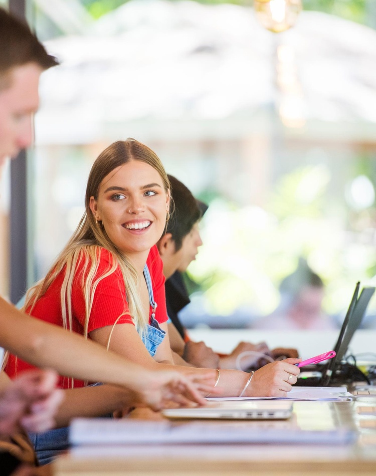 SCU Student on laptop in Lismore Campus Library