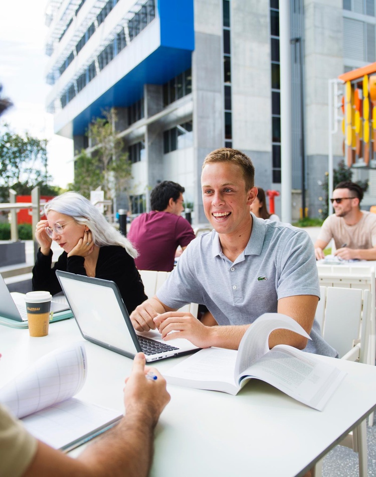 Students learning at Gold Coast campus using laptops