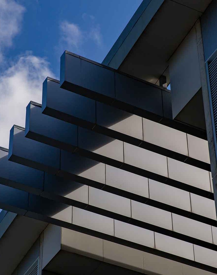 Architectural photo featuring pillars and shadows