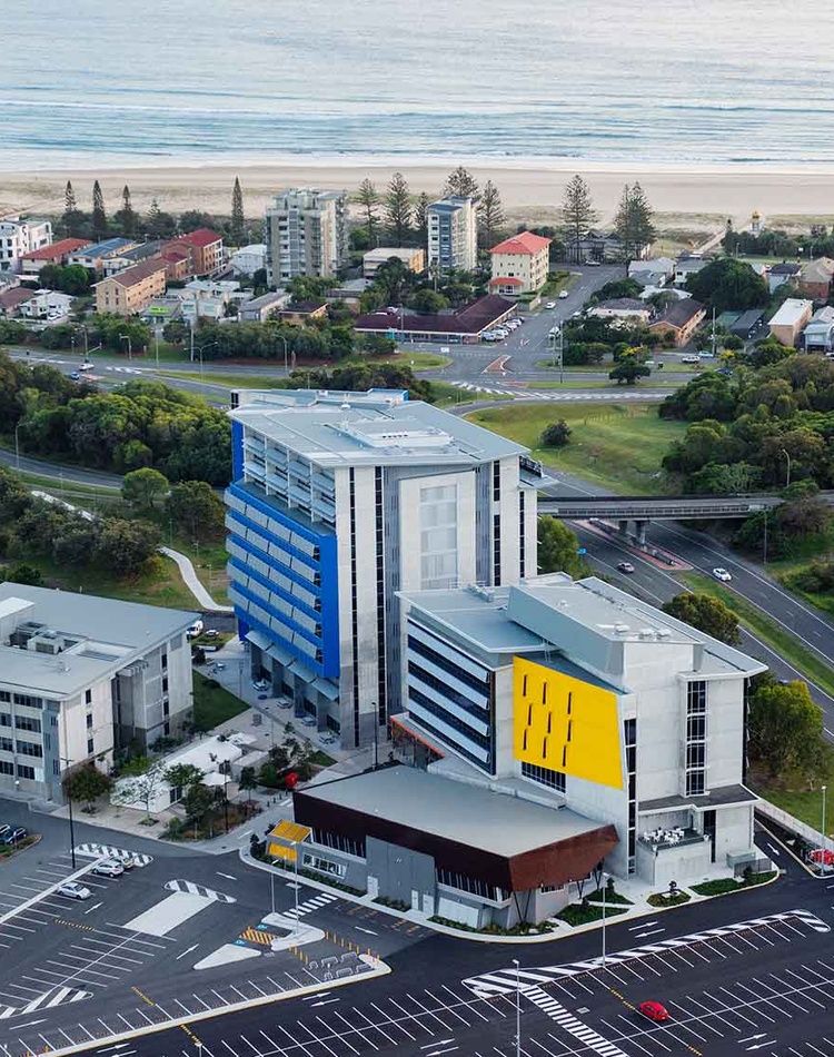 Aerial shot of Gold Coast campus with beach shoreline in the background