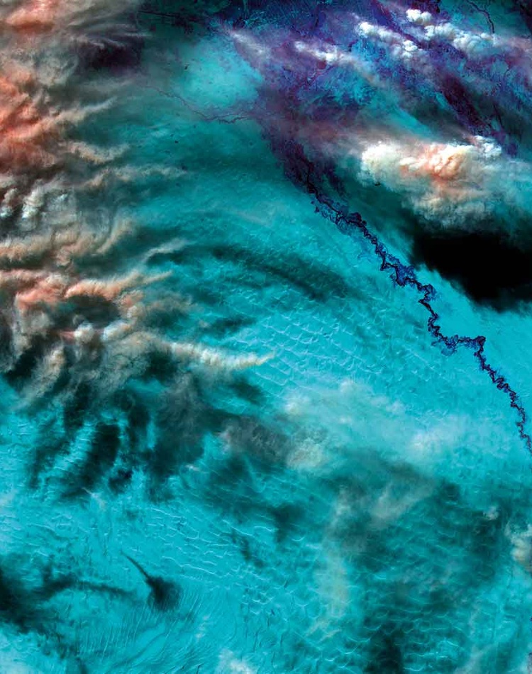 Grayson Cooke false-colour rendering of clouds over the Taklamakan Desert in China
