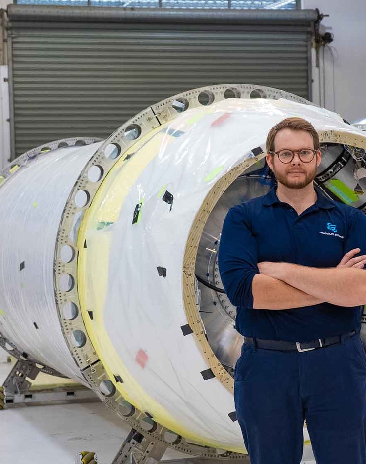 Mitch in front of machinery