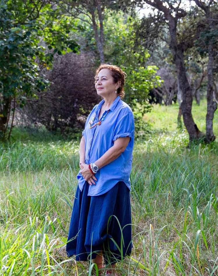 Nicole Tujague PhD stands in nature