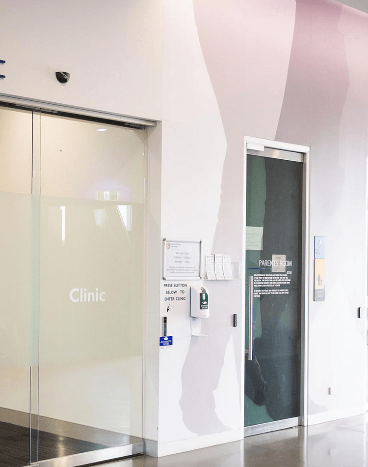 Students walking towards Health Clinic