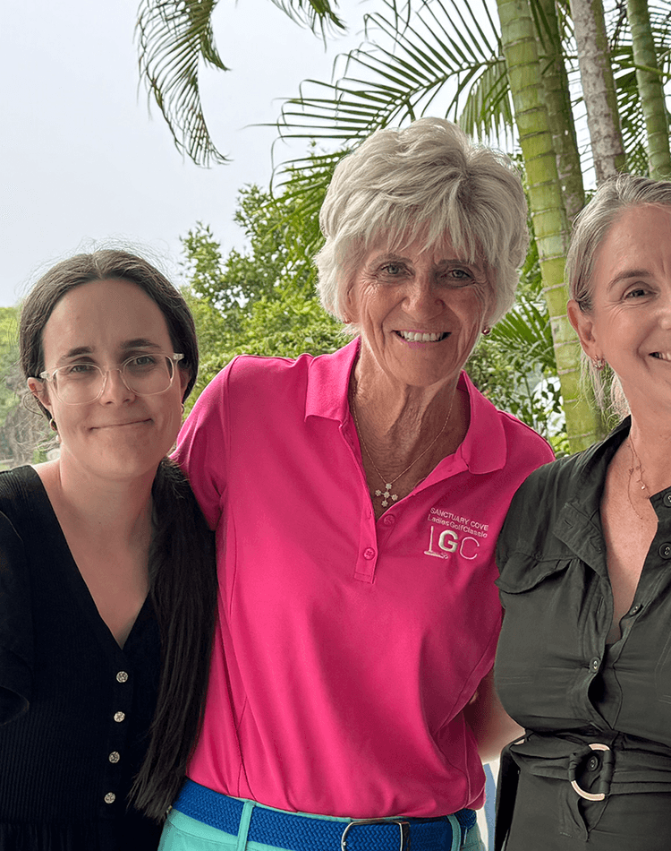 Three women smiling at camera