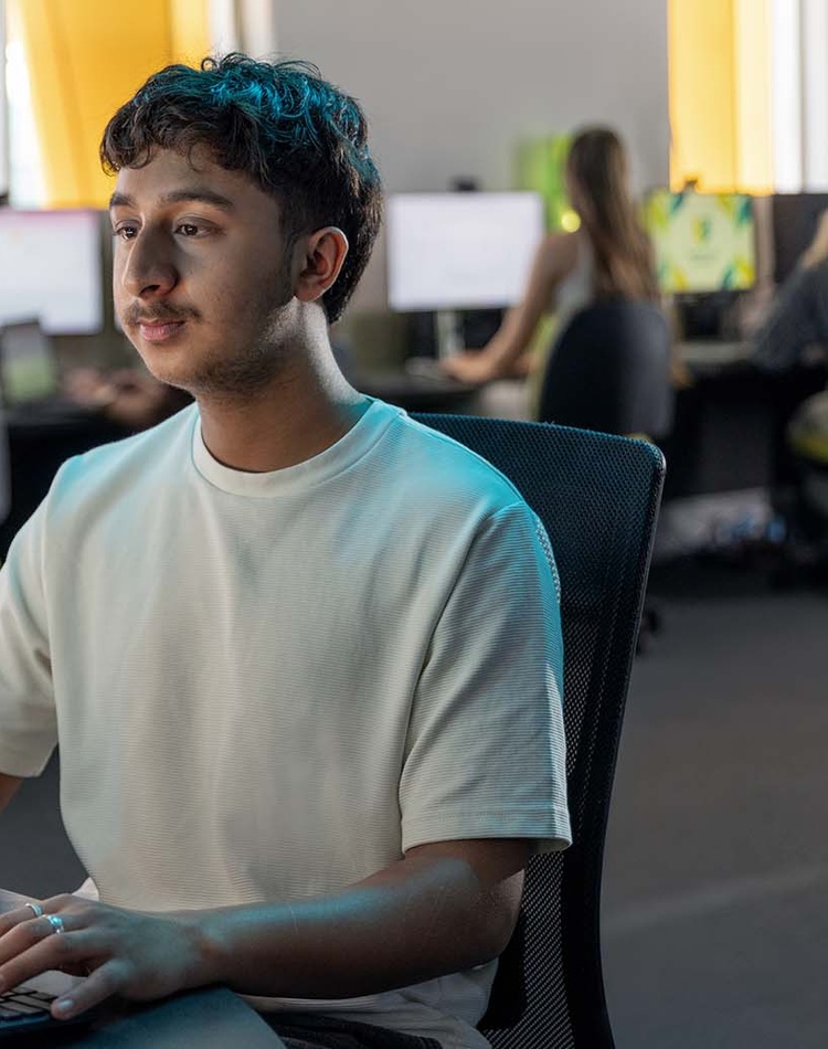 IT student in computer lab on campus