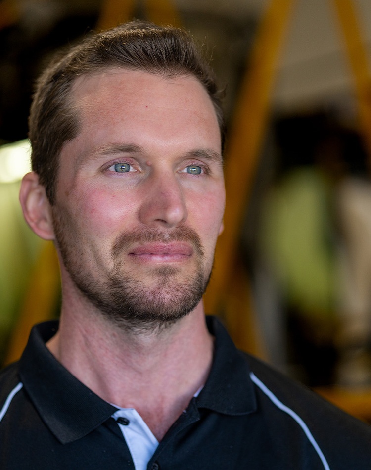 Headshot of man looking off camera