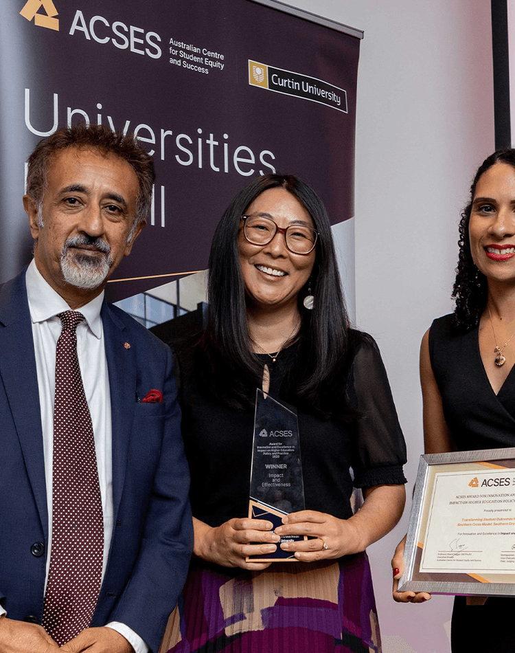 Professor Shamit Saggar (ACSES Executive Director) and Dr Cassy King (ACSES Awards Judging Panel Member and presenter of the award) with Dr Liz Good, who received the award on behalf of the Southern Cross University team.