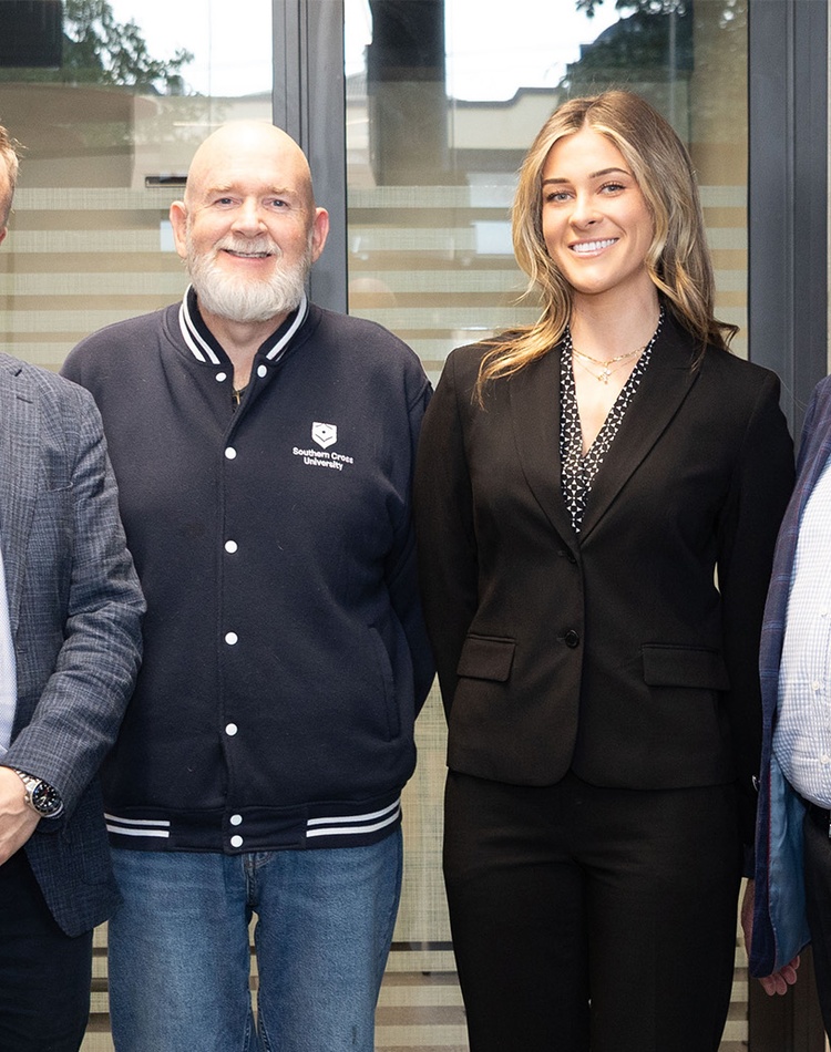 Ben Roche, Mike Ewing, Isabella Dowd and John Williams smiling at camera