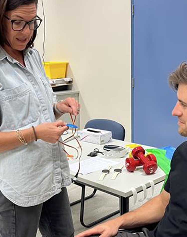 Woman talking with man in wheelchair