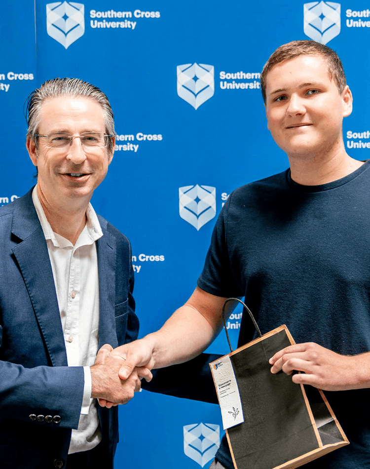 Vice-Chancellor Professor Tyrone Carlin with scholarship recipient Joseph Dittmar