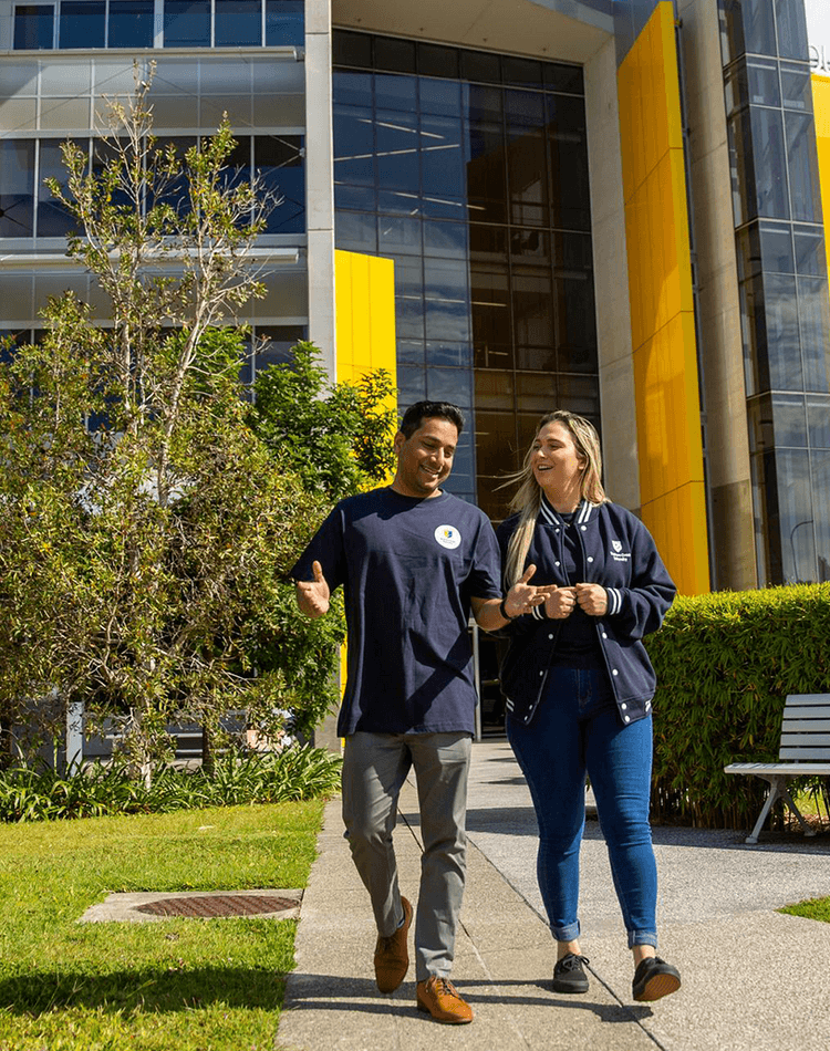 two students walking outside Gold Coast campus