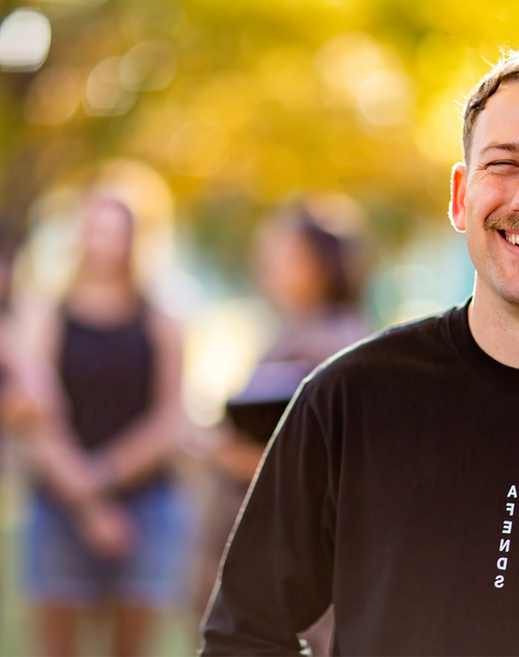 Student smiling on campus