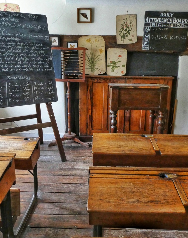 Image of a classroom setting with blackboard