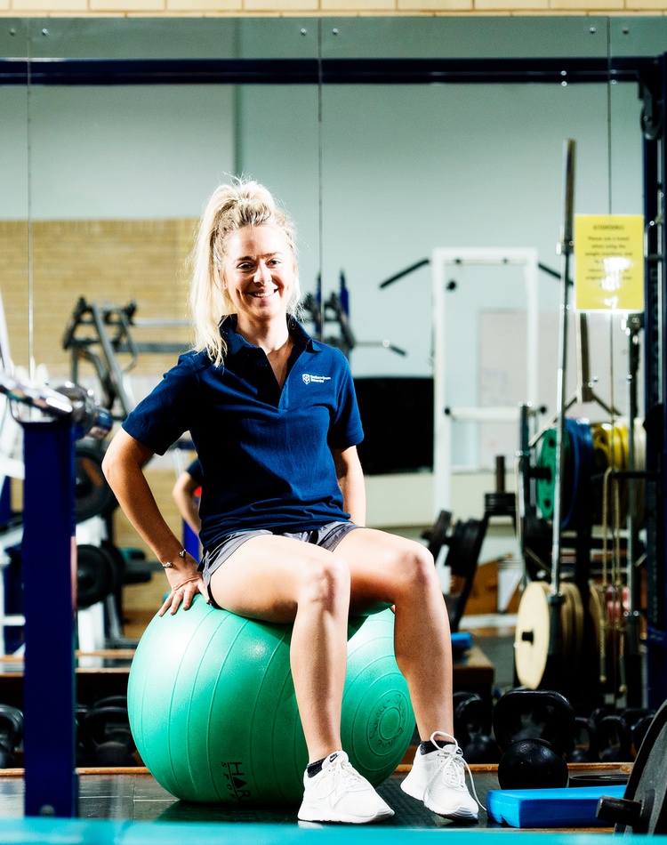 Smiling student in gym exercise science