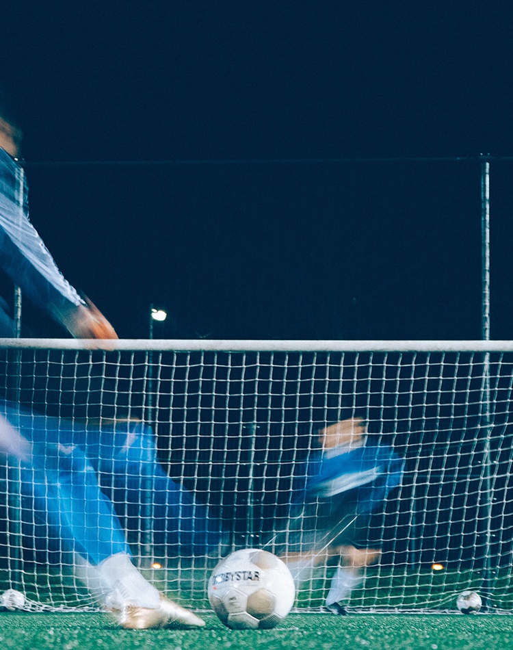 Soccer ball, players and net