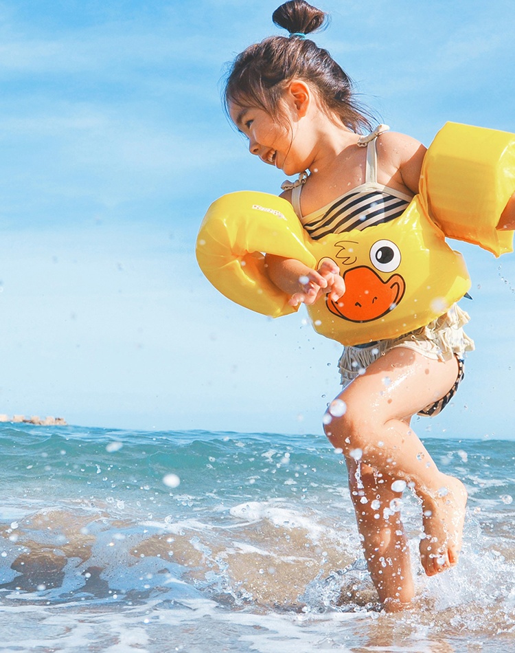 Happy child playing at beach