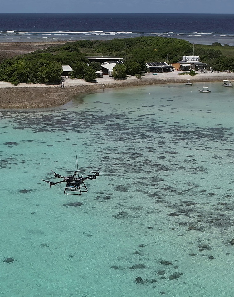 Drone flying above lagoon at One Tree Island