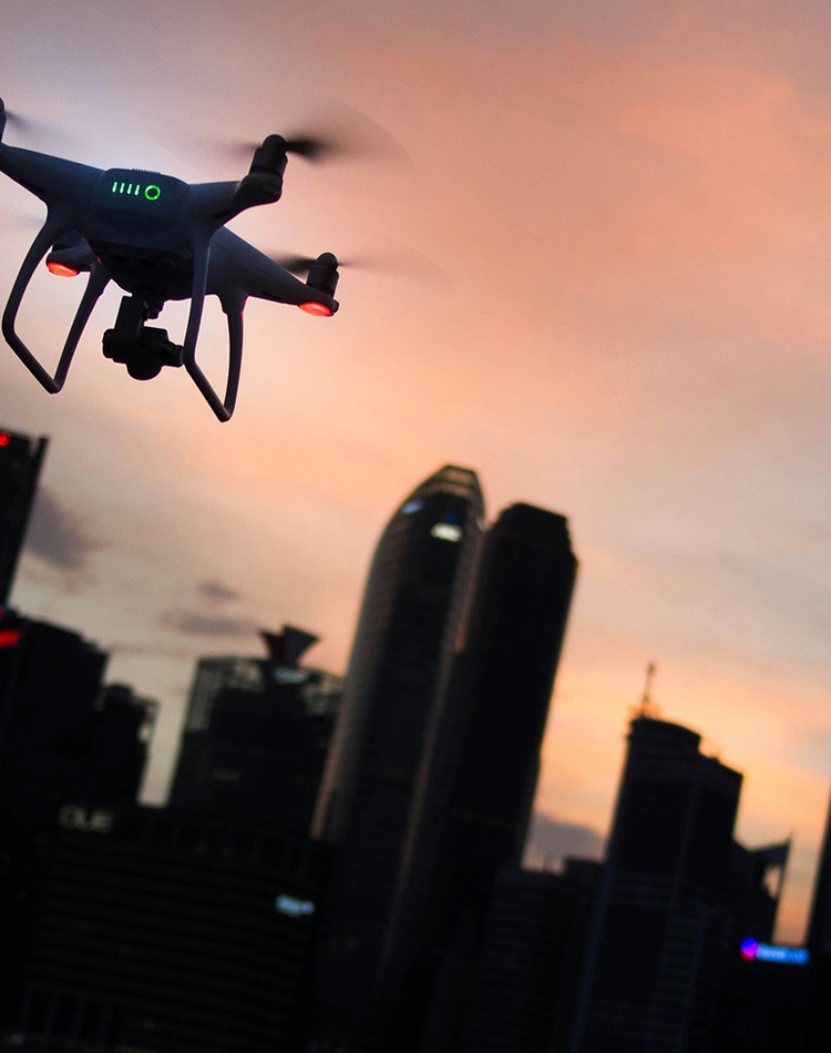 Drone over city at dusk_credit Goh Rhy Yan on Unsplash
