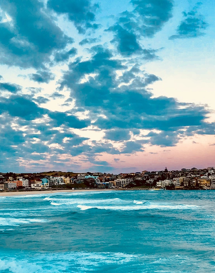A view of a city beach at sunrise or sunset