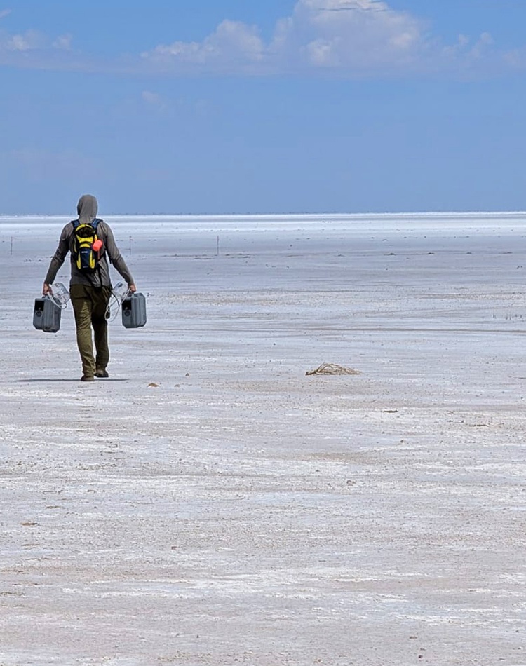 A man walking on a salt lake