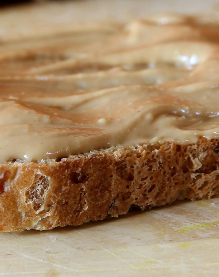 Sliced bread with peanut butter topping