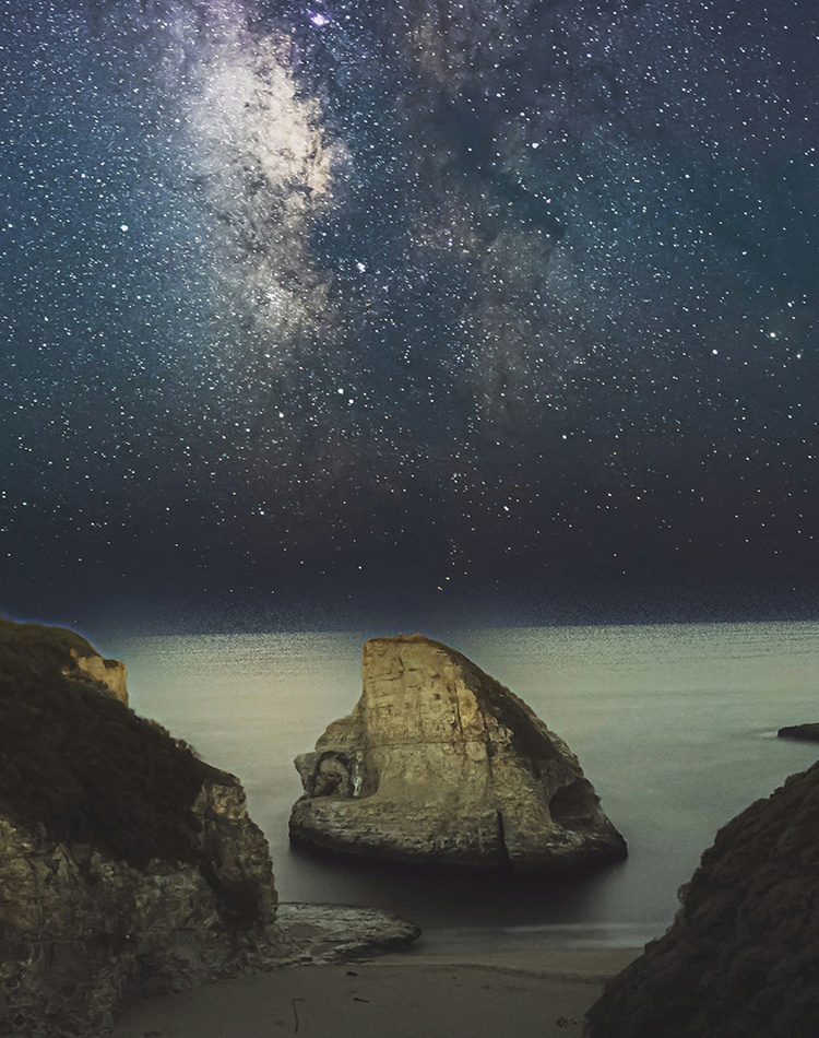 A night sky with milky way observed from a beach