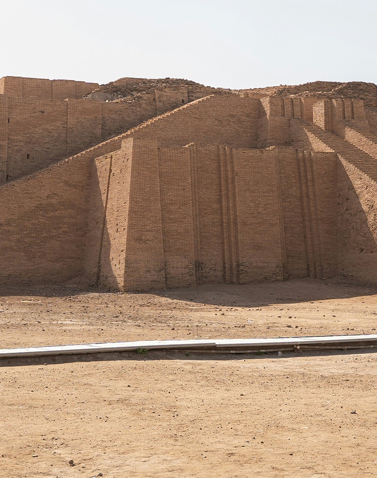 Large stone structure sitting in the middle of a desert