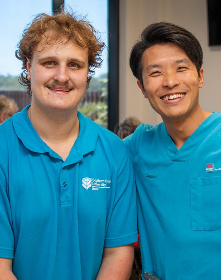 2 men in blue uniform shirts