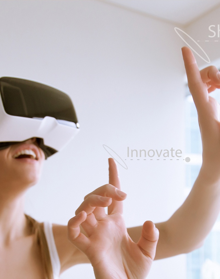 young girl wearing a virtual reality headset with her hands in the air reaching out to touch
