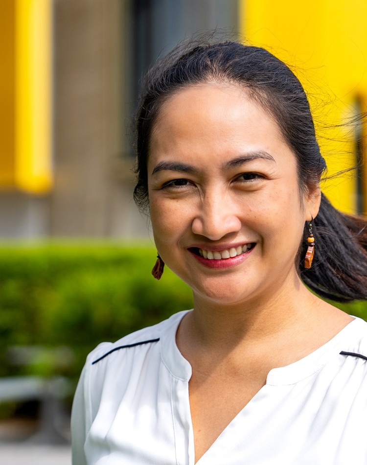A woman smiling at the camera