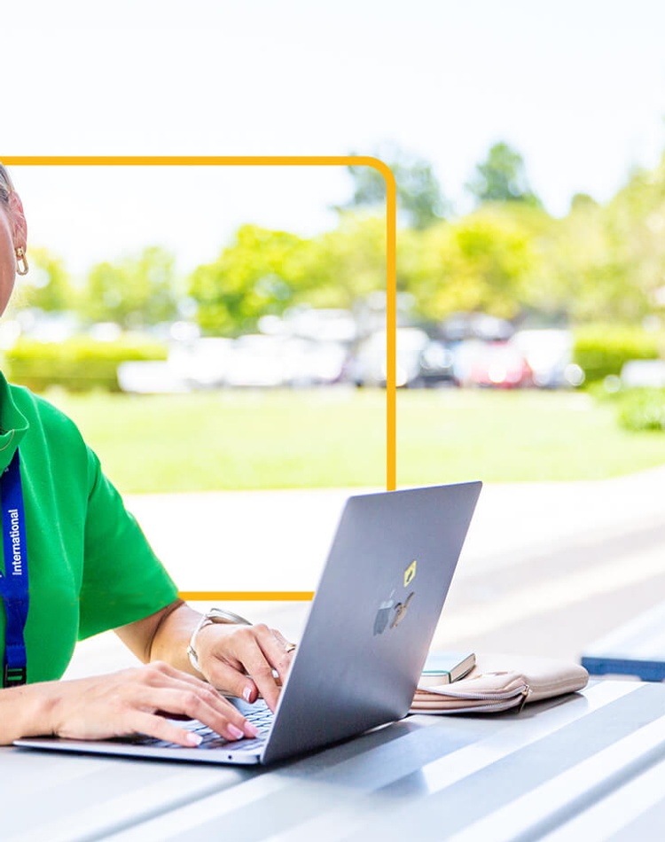 Student with laptop at Gold Coast campus.