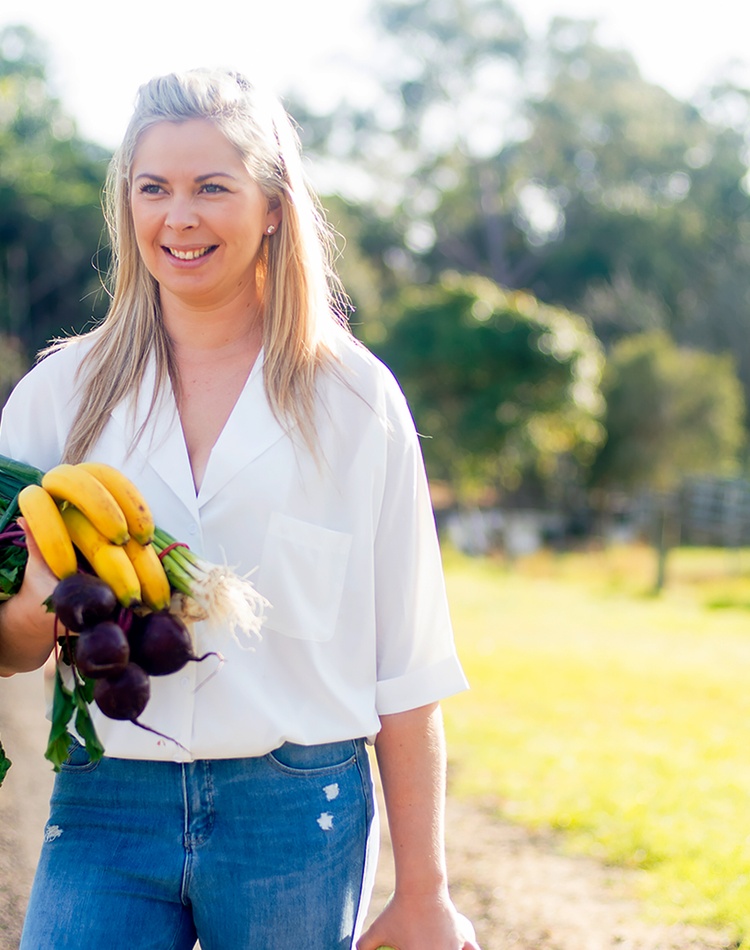 business woman holding fruit