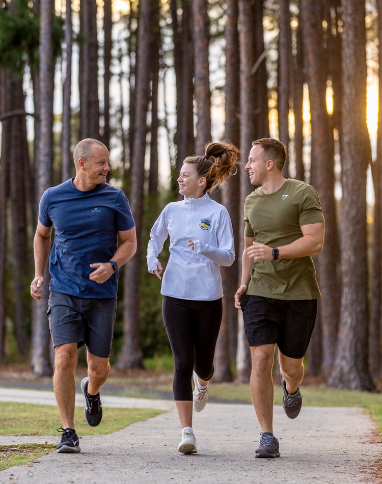 Three people jogging together