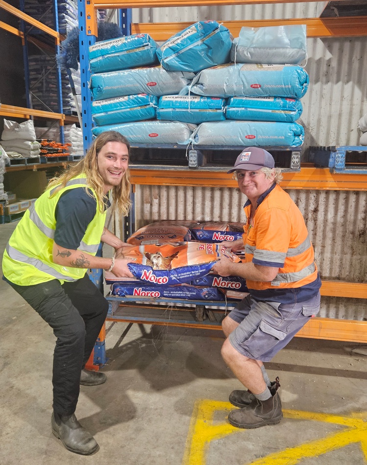 OT student Lachlan Andrews and Norco worker Gary Vidler do two person lift