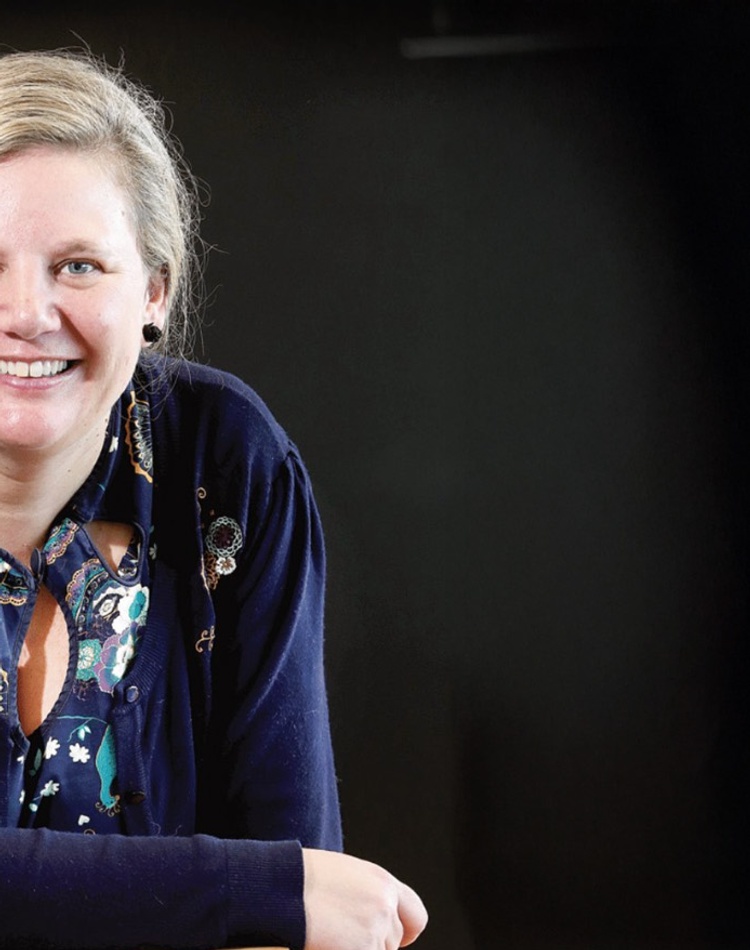 Woman smiling with black background