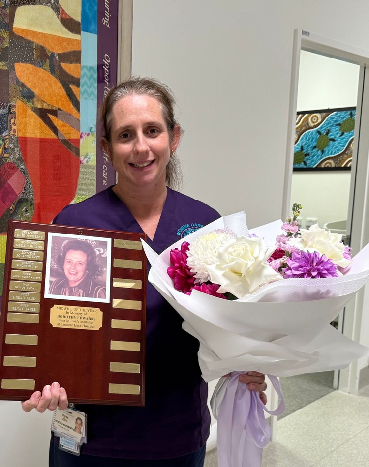 Midwife Renay James holds her Dorothy Edwards Scholarship award