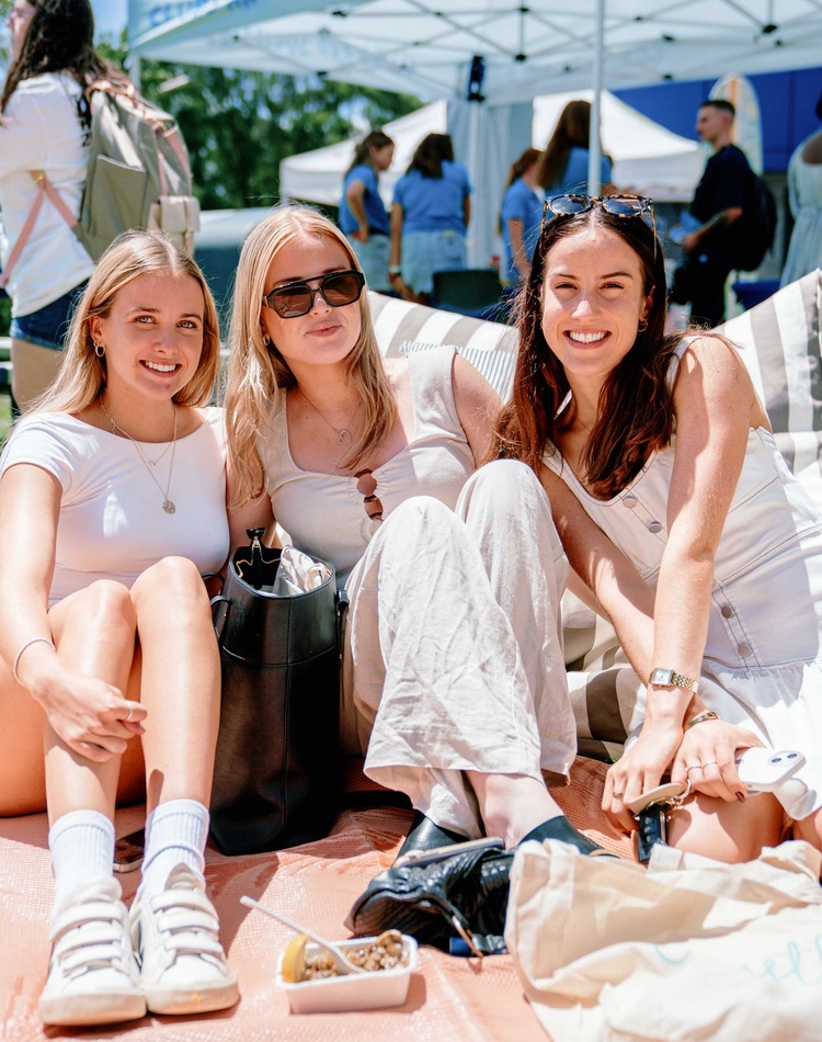 Student group sitting on grass