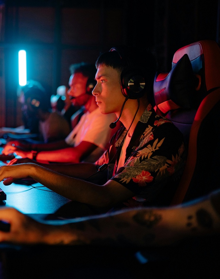 A group of males playing esports