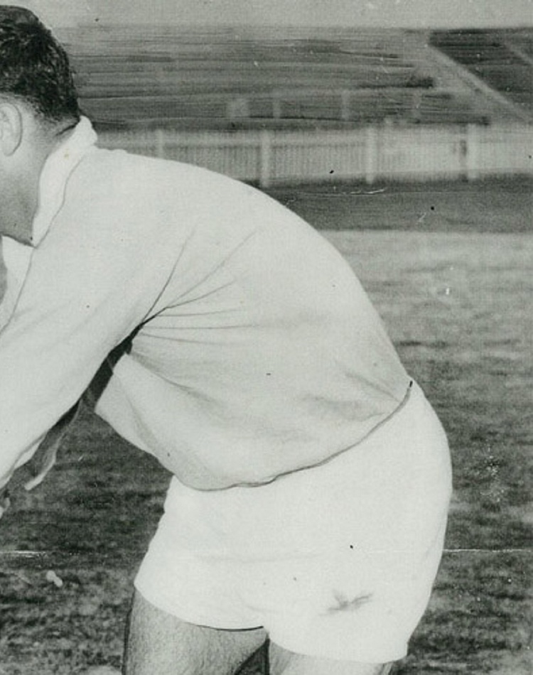 A man passing a rugby ball, black and white photograph