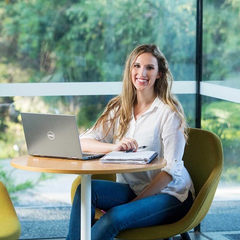 Student at table with laptop