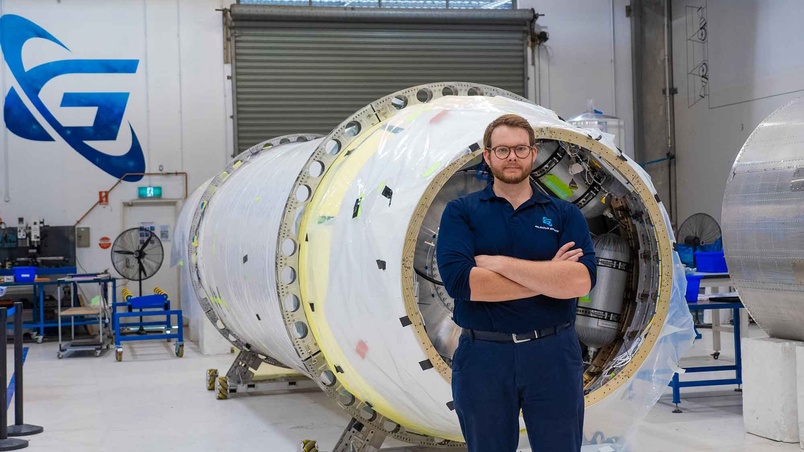 Mitch in front of machinery